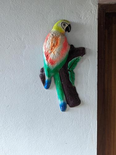 a toy bird is on a wall at Hotel Playa Santa Martha in Rivas