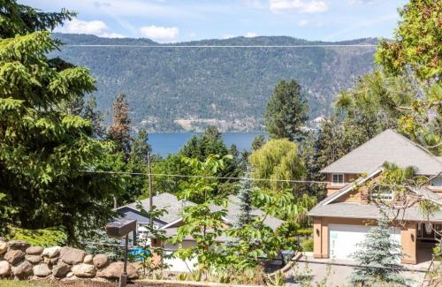 a house with a view of a lake at The Blue House Bed and Breakfast in Lake Country