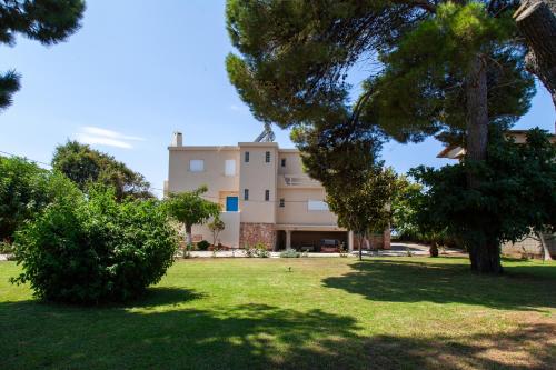 a view of the house from the park at Villa Moby Dick in Mitikas