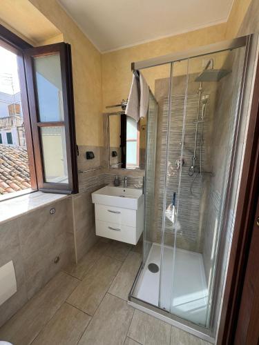 a bathroom with a shower and a sink at B&B Rivellini in Tropea