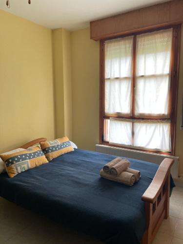 Cama o camas de una habitación en Apartamentos Melgarden - El Balcón de los Lirios