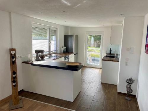 a kitchen with a counter top in a room at Anitas Ferienwohnung in Meßkirch