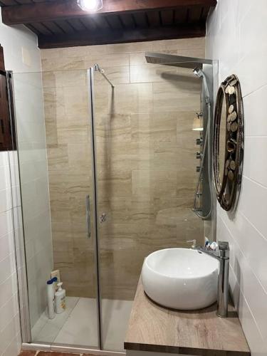 a bathroom with a sink and a shower at Sierra de Huelva-Chalet completo in El Cerro de Andévalo