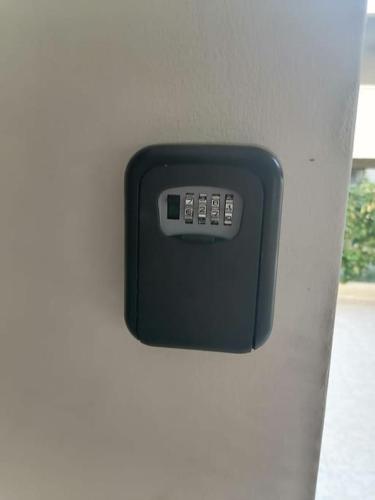 a remote control on the side of a wall at Comfy Apartment Near Paphos in Yeroskipou