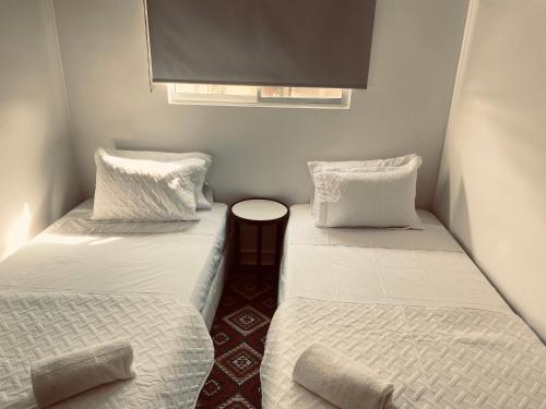 En eller flere senger på et rom på Apartamento céntrico Plazuela