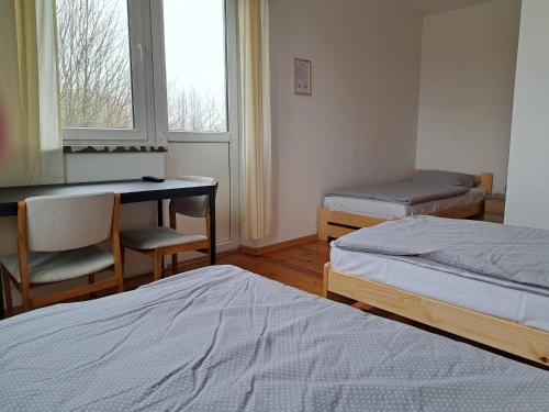 Cama o camas de una habitación en P&P noclegi - Krosno Sikorskiego