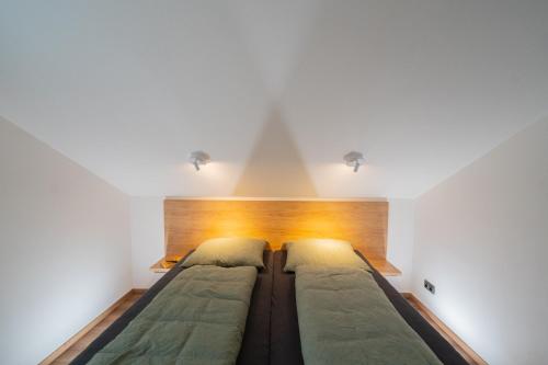Giường trong phòng chung tại Apartmán Malá Morávka - DZ RENT