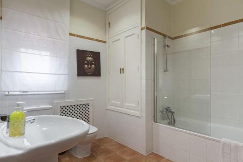 a bathroom with a sink and a toilet and a shower at Luxury Villa in Alicante in Alicante