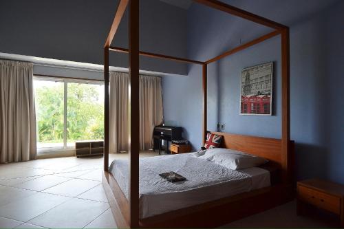 Ένα ή περισσότερα κρεβάτια σε δωμάτιο στο Seaside villa with housekeeping staff - Las Terrenas