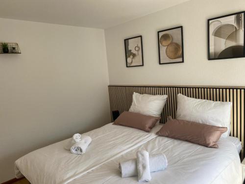 Un ou plusieurs lits dans un hébergement de l'établissement Appartement Au Rhin mit Balkon in Bad Bellingen