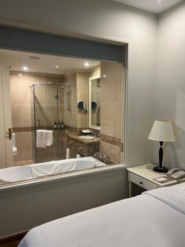a large bathroom with a tub and a shower at Rio‘s home7 in Vung Tau