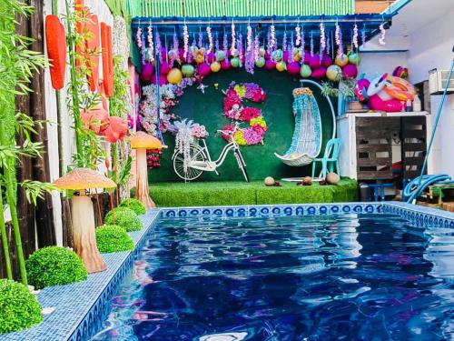 a pool in the middle of a house with a garden at Sharon’s Private Pool Villa in Mandaue City