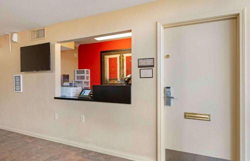 a hallway with a door leading into an office at Extended Stay America Suites - Fort Wayne - North in Fort Wayne