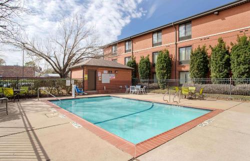 a swimming pool in front of a building at Extended Stay America Suites - Houston - Northwest - Hwy 290 - Hollister in Houston