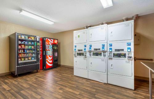 a room with two refrigerators and a soda machine at Extended Stay America Select Suites - Atlanta - Alpharetta - Northpoint - East in Alpharetta