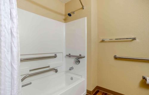 a bathroom with a shower with a white tub at Extended Stay America Select Suites - Destin - US 98 - Emerald Coast Pkwy in Destin