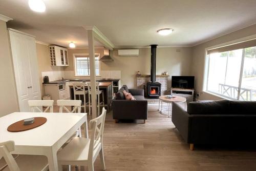a living room with a couch and a table at St Albert House in Myrtleford