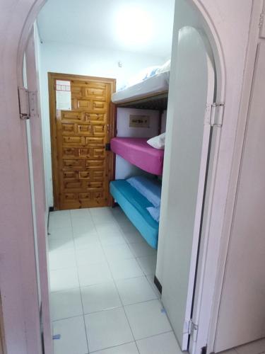 a small room with some bunk beds in it at Estudio naturista 1 in Vera