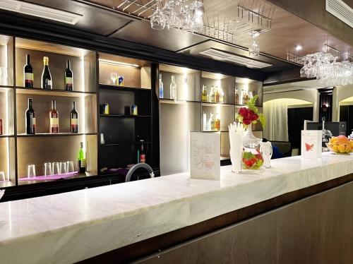 a bar with a counter with bottles of wine at NILE CRUISE LUXOR & ASWAN نايل كروز الاقصر و اسوان in Luxor