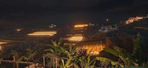 a view of a factory at night with lights at Windy Home in Ấp Man Ling