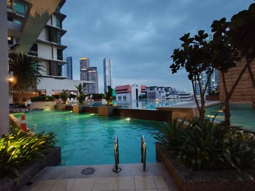 a swimming pool in the middle of a building at No Other Fee #Swiss Garden Residences by The Boston House #Bukit Bintang in Kuala Lumpur