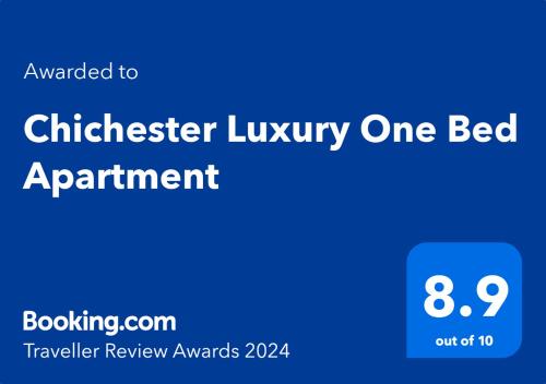 a blue sign that says chickler luxury one bed apartment at Chichester Luxury One Bed Apartment in Chichester