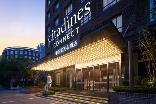 a building with a sign that reads chicago college of commerce at Citadines Connect Chayuan Chongqing in Changshengqiao