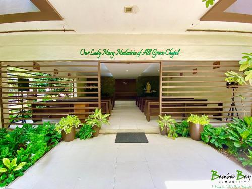 a building with a sign that reads our happy birthday malaysian civil guest club at CF Haven - Resort Living Condo w/ Balcony at Bamboo Bay in Mandaue City