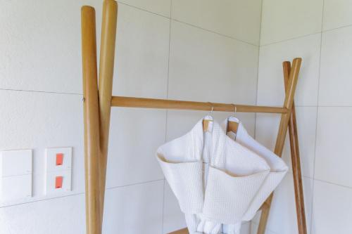 a couple of white towels hanging on a rack in a bathroom at The Bellwood Manor in Nuwara Eliya