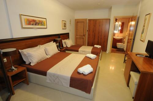 Katil atau katil-katil dalam bilik di Philippeio Hotel
