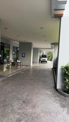 a car parked inside of a building with a car garage at Circle condominium in Makkasan