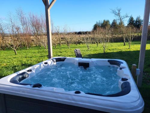 a jacuzzi tub sitting in a yard at Stone Barn in Skibbereen