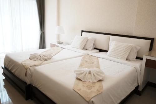 Ένα ή περισσότερα κρεβάτια σε δωμάτιο στο Herry Residence