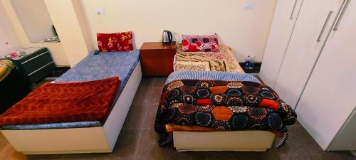 A bed or beds in a room at GRACE DORMATORY