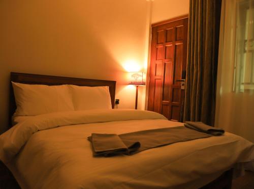 Postelja oz. postelje v sobi nastanitve River House Lodge International