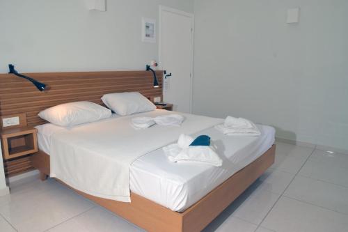 Ένα ή περισσότερα κρεβάτια σε δωμάτιο στο Mithos Premium Rooms
