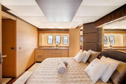a bedroom with a large bed in a boat at Yacht Joy 4 cabin in Porto Cervo