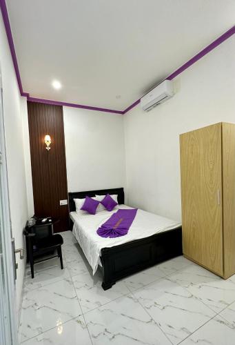 Postel nebo postele na pokoji v ubytování Minh Hoàng Hotel - Phan Thiết