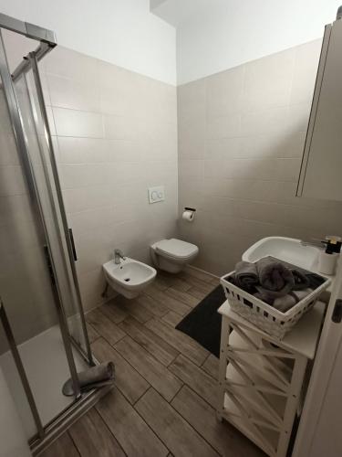 a bathroom with a toilet and a sink at Apartments Fewo in Bolzano