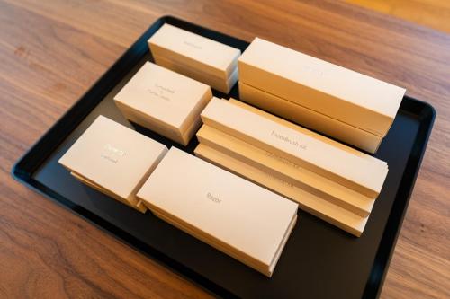 a black tray with four boxes on a table at theView 南房総 in Ichibu