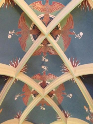 a ceiling with a bunch of birds painted on it at Apartmenthotel Quartier M in Leipzig