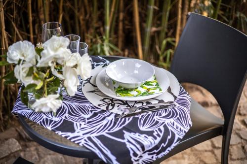 a table with a plate of food and a bowl at Craigivar Guesthouse in Pretoria