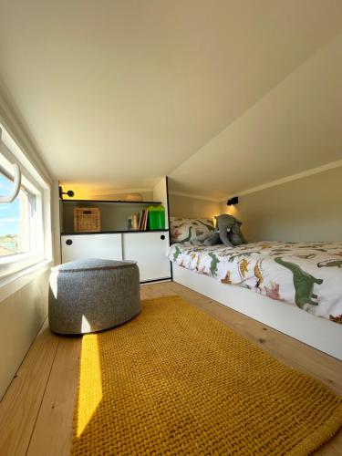 Postel nebo postele na pokoji v ubytování Tiny House Alpakablick - inklusive gratis Alpaka Meet & Greet