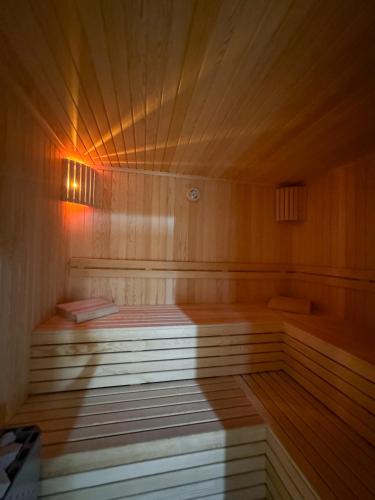 a large wooden sauna with a wooden floor at Çelik Thermal & Spa in Pamukkale