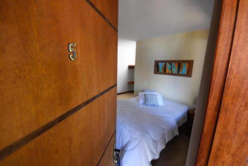 Pousada Paris Hostelliにあるベッド