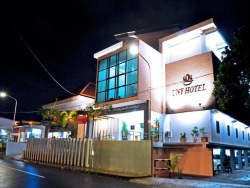 a my hotel is lit up at night at UNY Hotel in Demangan