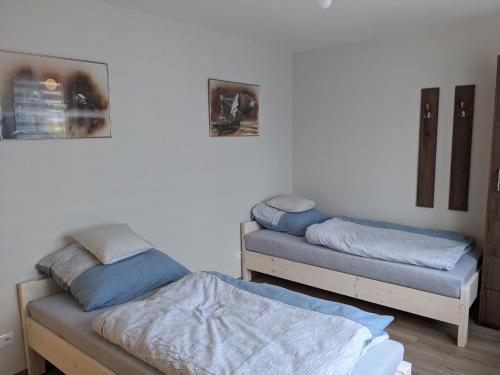 a room with two beds and a bedvisor at Rigel Rooms in Piotrków Trybunalski