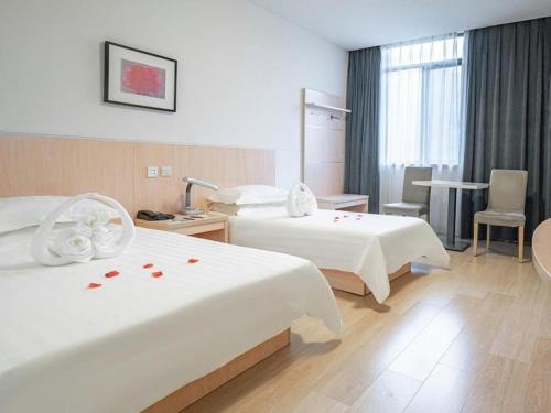 Katil atau katil-katil dalam bilik di Jinjiang Inn E'ling Cultural and Creative Second Factory