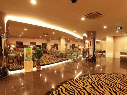 a hotel lobby with a zebra patterned floor at Zibo Blue Horizon International Hotel in Zibo