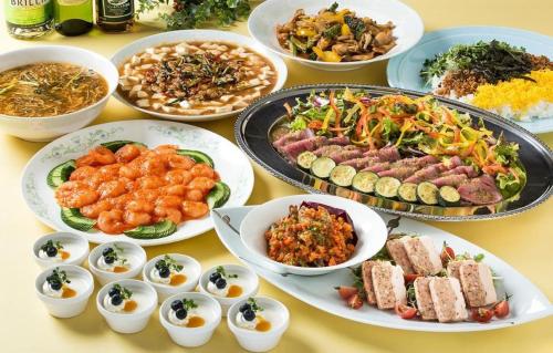 a table topped with plates of food and bowls of food at Oita Century Hotel in Oita
